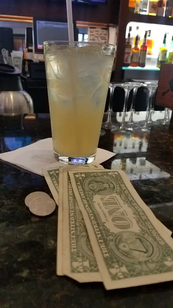 Drink free when observing what bartenders do with cash payments.
