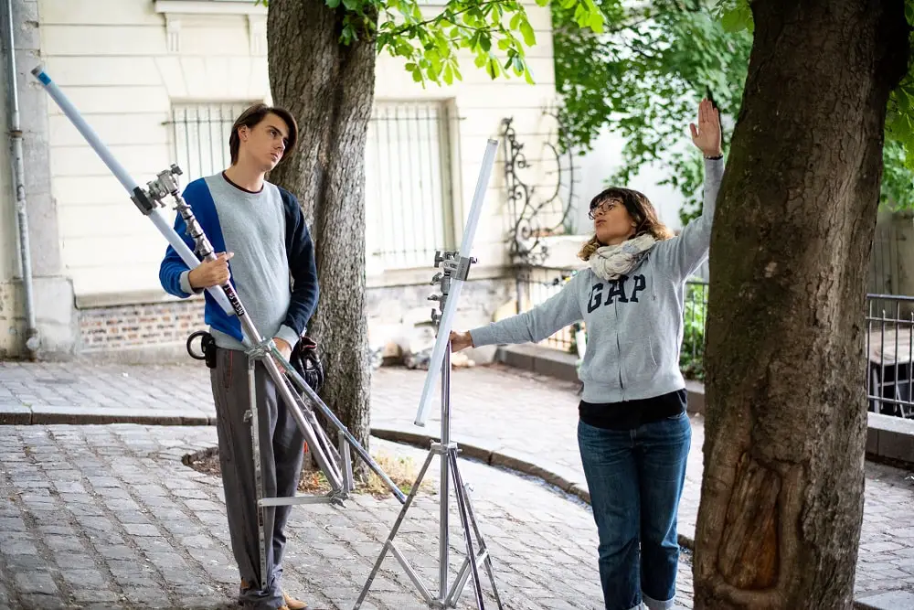 Gaffer giving direction to my electric to set up Astera lights for a fill lighting on the characters. Short Film “Magnifique” directed by Franck Victor.